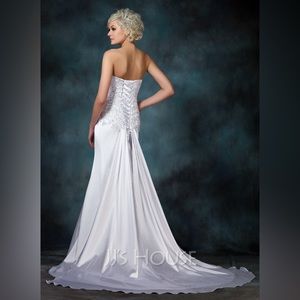 Used wedding dress. Size 2. Altered. Professionally cleaned and preserved